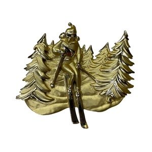 AJC marked gold toned matte finish girl skierIn the forest shaped brooch pin